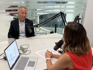 Two professionals talking about the semiconductor industry on a podcast.