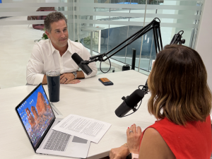 Two professionals talking about the semiconductor industry on a podcast.